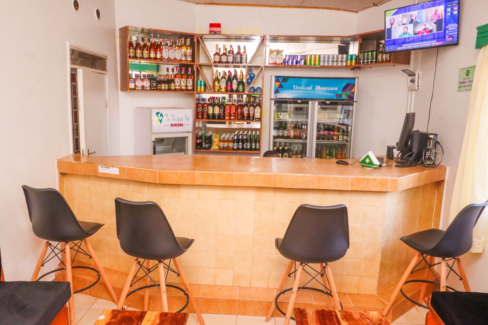 The bar counter set for evening cocktails at The Westgate Inn